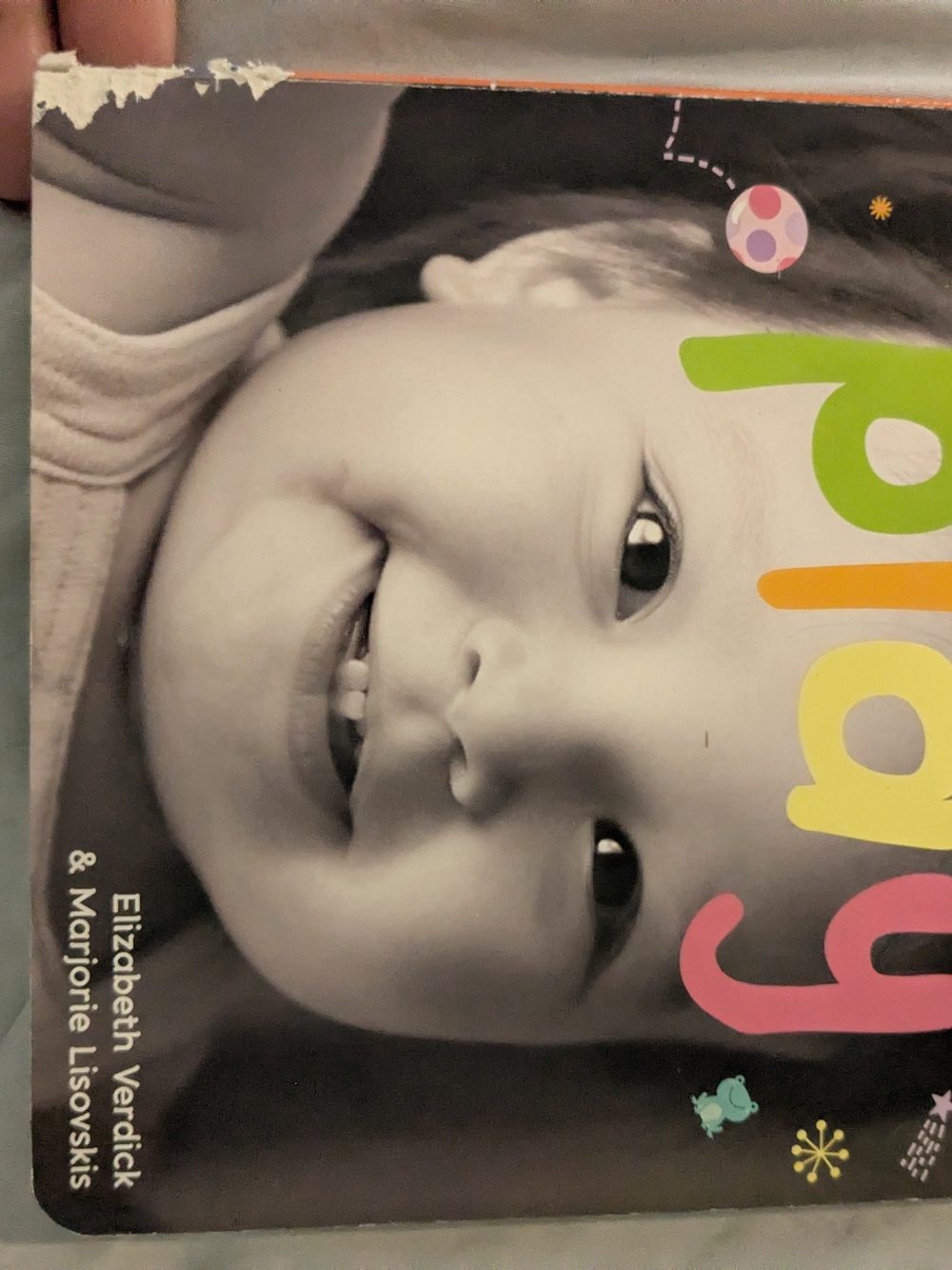 Scholastic board book with green yellow pink accents